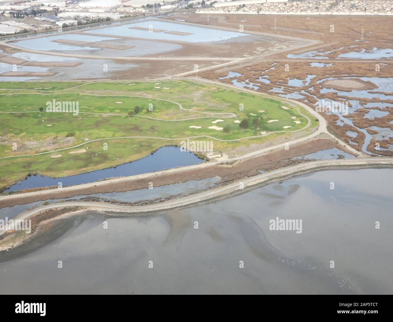Heron Bay and neighborhoods are visible in an aerial view of the East