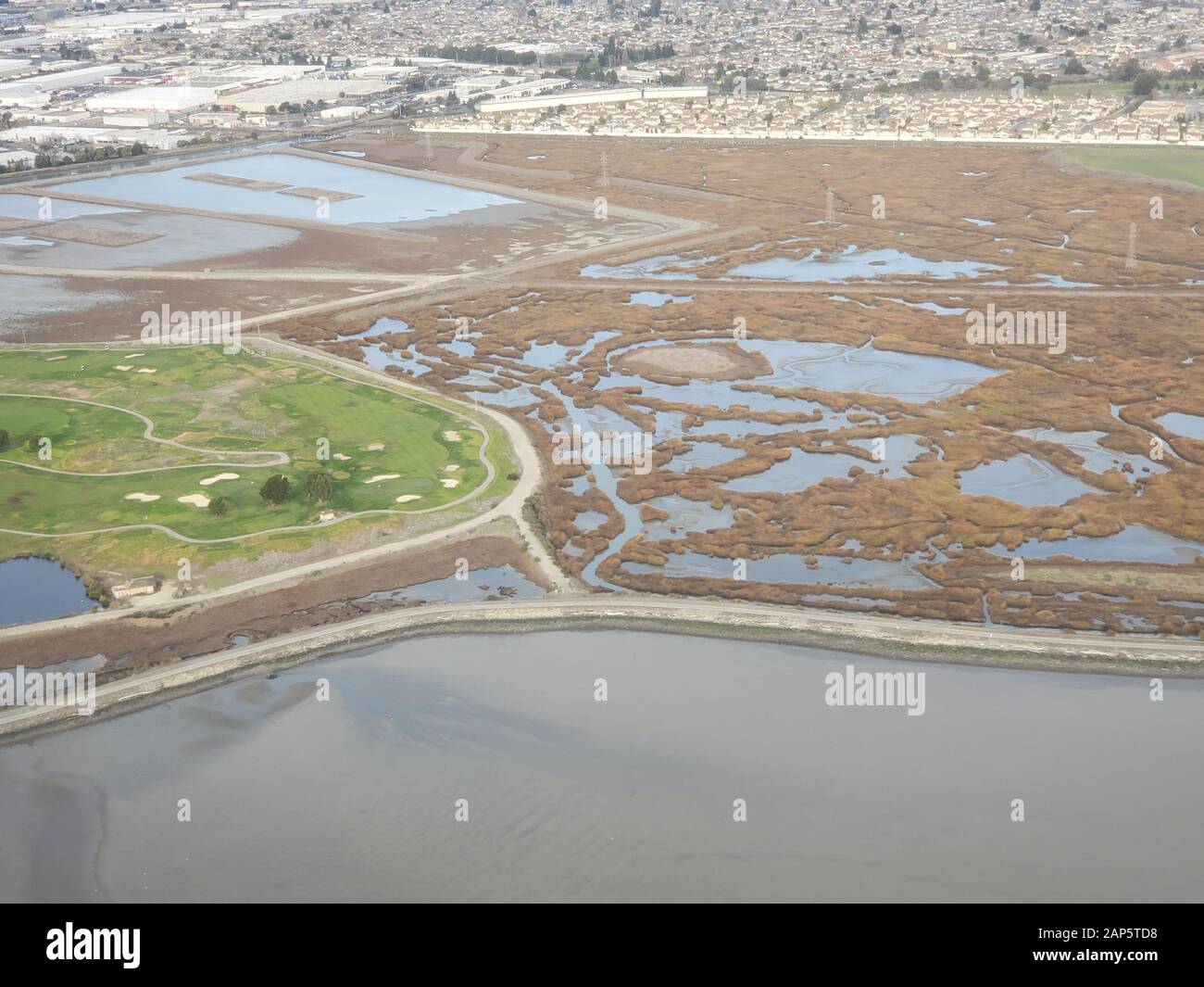 Heron Bay and neighborhoods are visible in an aerial view of the East