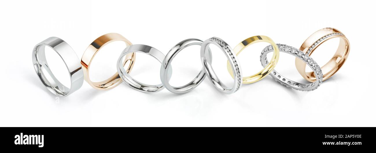 Assorted Wedding Rings in White Gold, Yellow Gold and Rose Gold. Wide Landscape Banner Style Photograph Isolated on White Background. Stock Photo