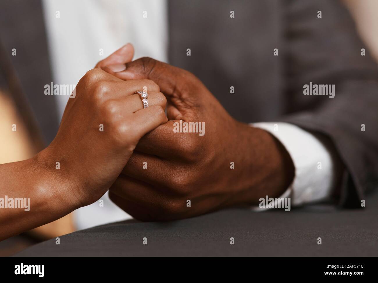 Cropped image of black couple in restaurant Stock Photo