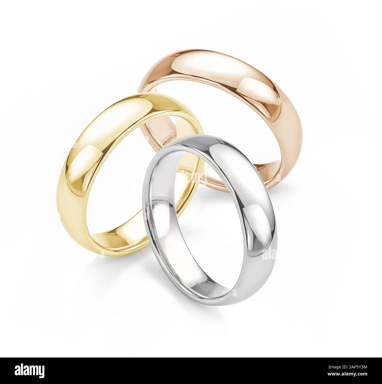 Wedding Rings. White Gold, Yellow Gold and Rose Gold Matching Wedding Rings Group Photograph Isolated on White Background. Stock Photo