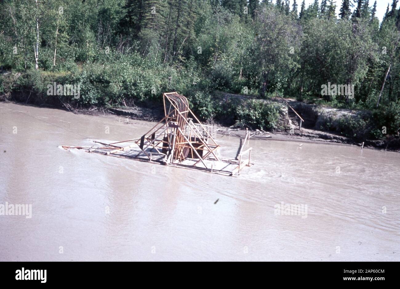 A makeshift raft is visible on a river in Africa, Zaire, 1987. () Stock Photo