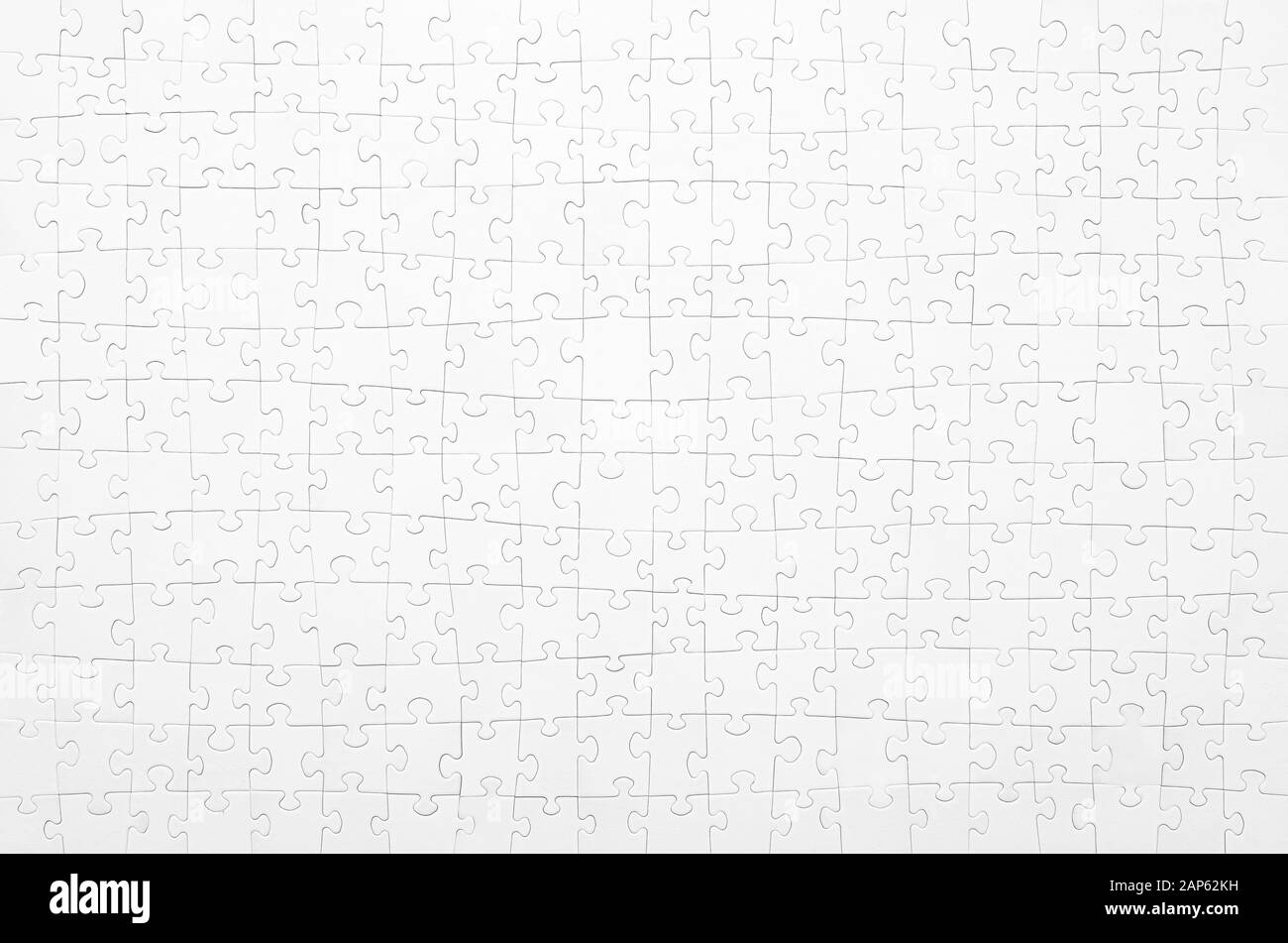 White jigsaw puzzle. Horizontal on white background copy space for your text. Stock Photo