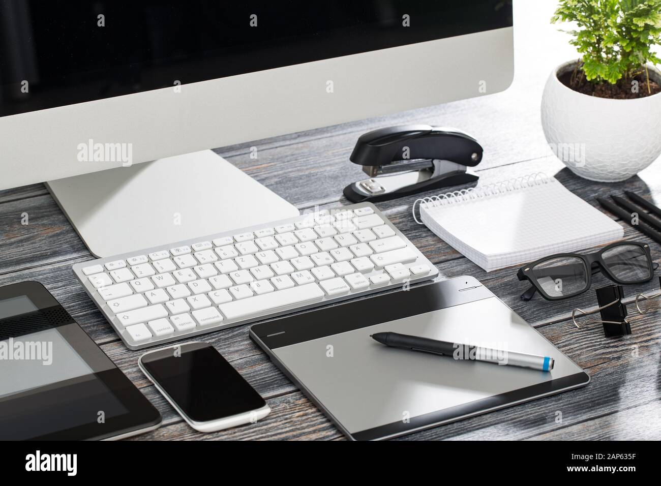 Designer's desk with responsive design mockup concept. Stock Photo