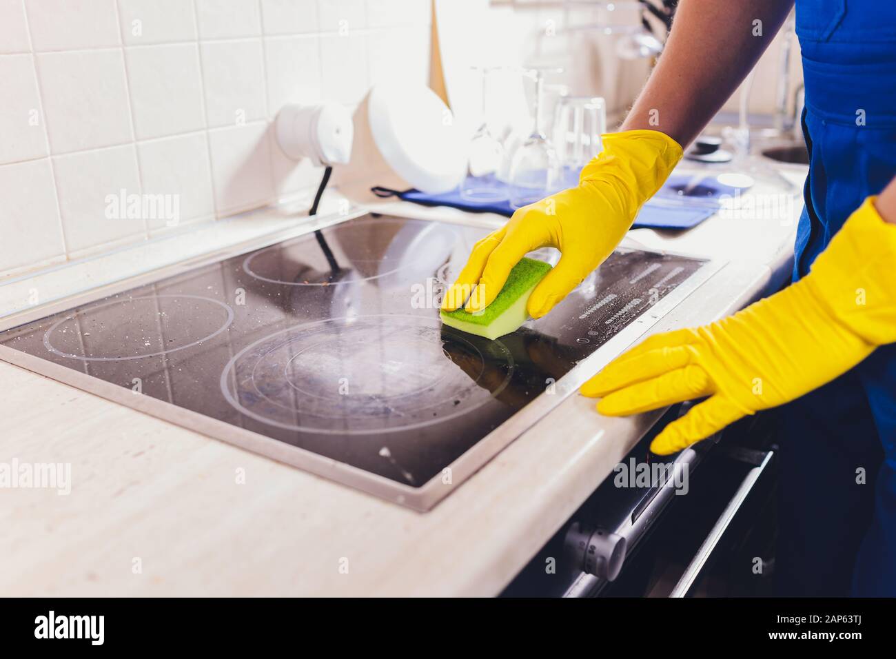 Cleaning kitchen hob with a steam cleaner Stock Photo Alamy