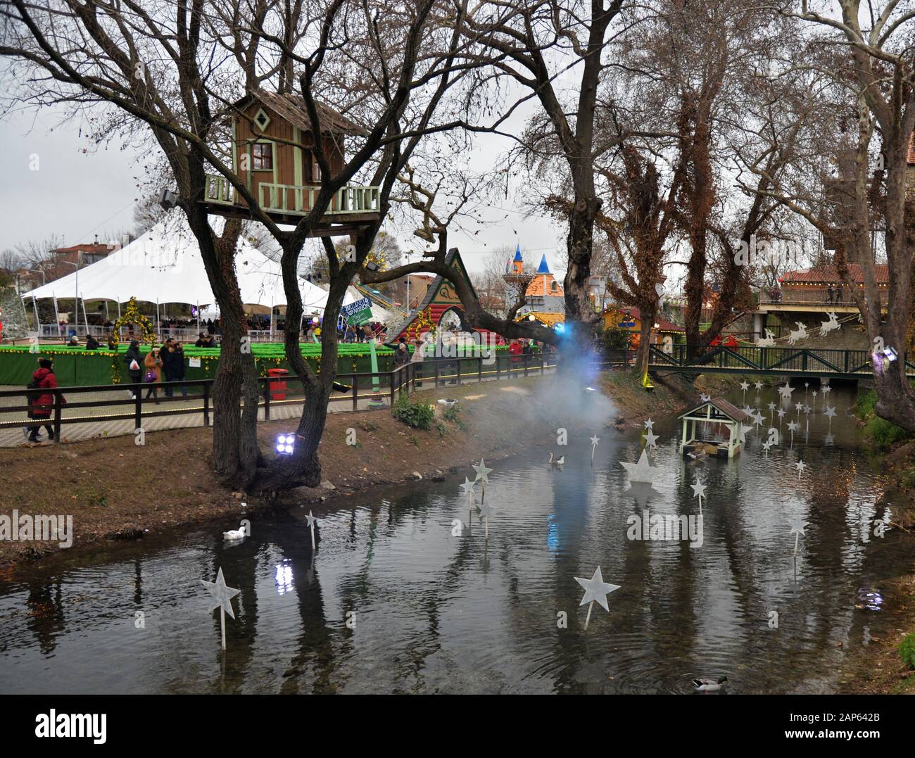 Small decorated pond and tree house situated in an area used as a venue for the 'Mill of the elves'a fair taking place at Christmas.Trikala, Greece. Stock Photo