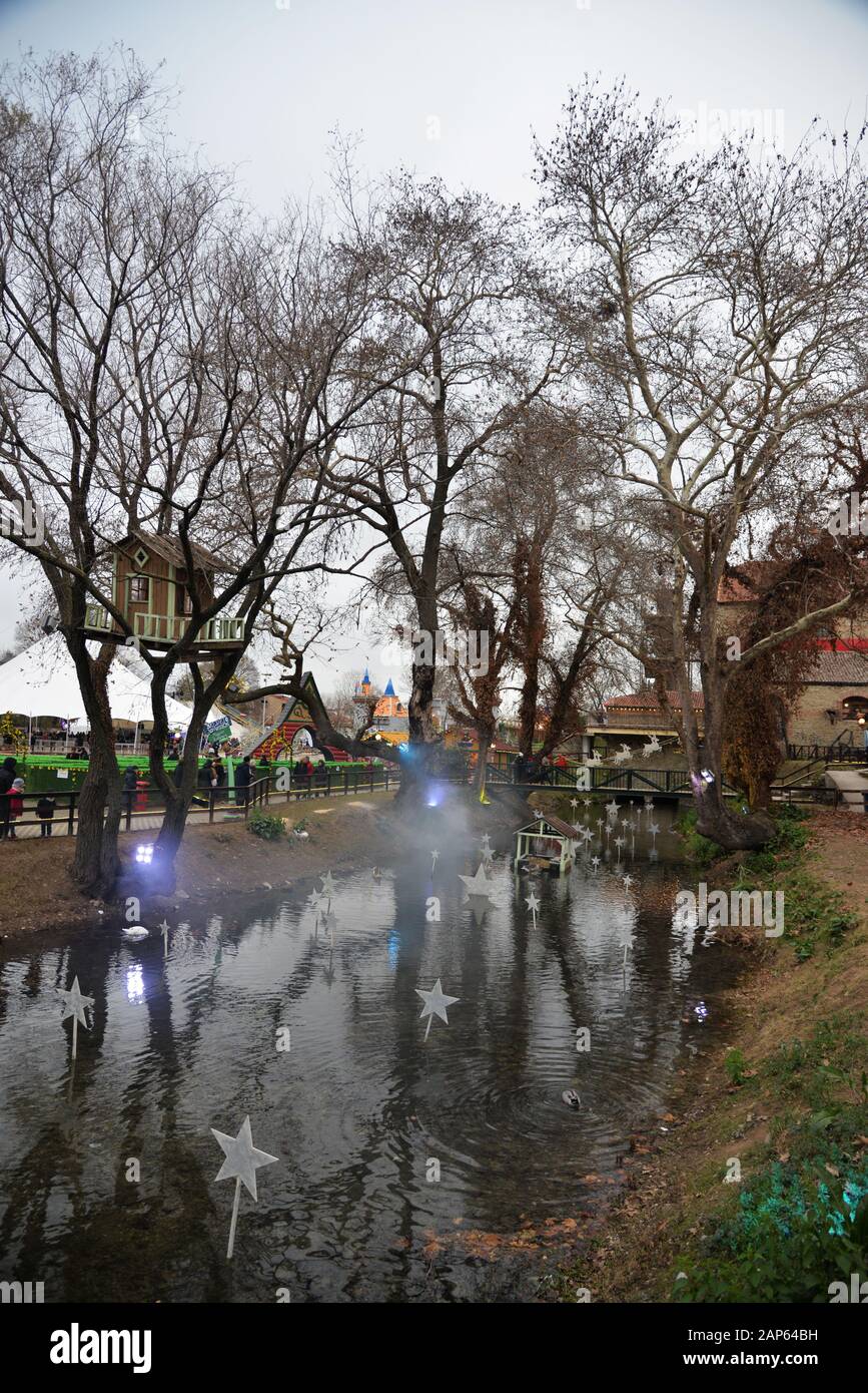 Small decorated pond and tree house situated in an area used as a venue for the 'Mill of the elves'a fair taking place at Christmas.Trikala, Greece. Stock Photo