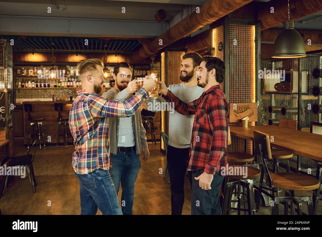 Group happy friends clinking hi-res stock photography and images - Alamy