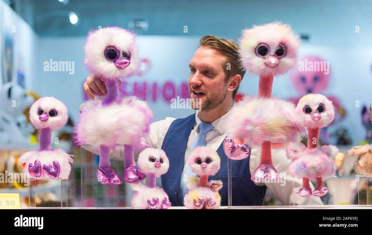 London, UK.  21 January 2020. A staff member presents toy ostriches by Ty Toys at the opening day of the Toy Fair, the largest dedicated toy, game and hobby trade exhibition in the UK, taking place at Kensington Olympia.  The show brings together many of the leading toy manufacturers and distributors and offers a chance for industry buyers to see the latest toys in preparation for Christmas.  Credit: Stephen Chung / Alamy Live News Stock Photo