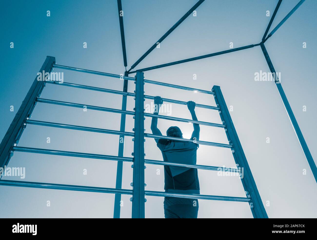 Man using outdoor beach gym in Spain Stock Photo