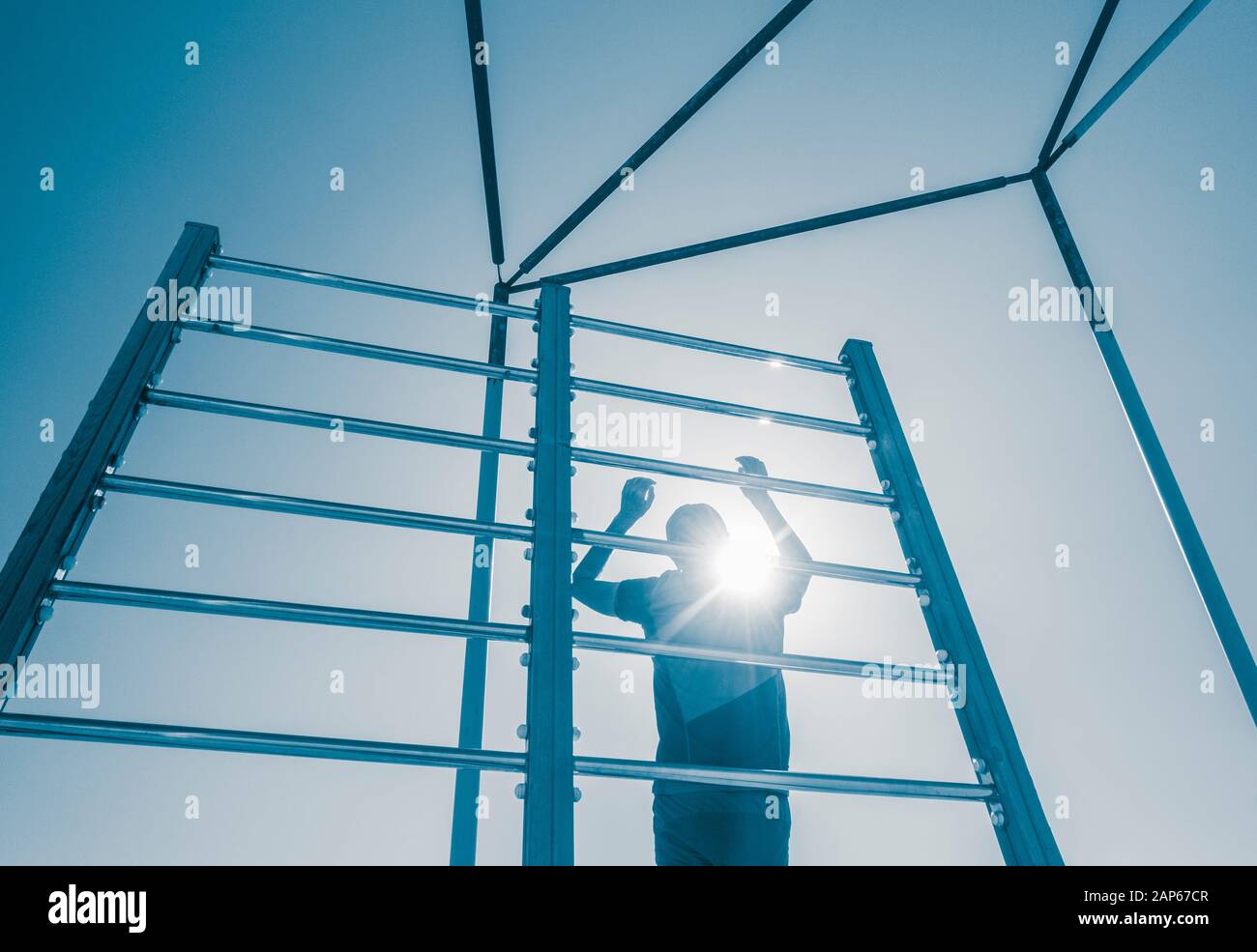 Man using outdoor beach gym in Spain Stock Photo