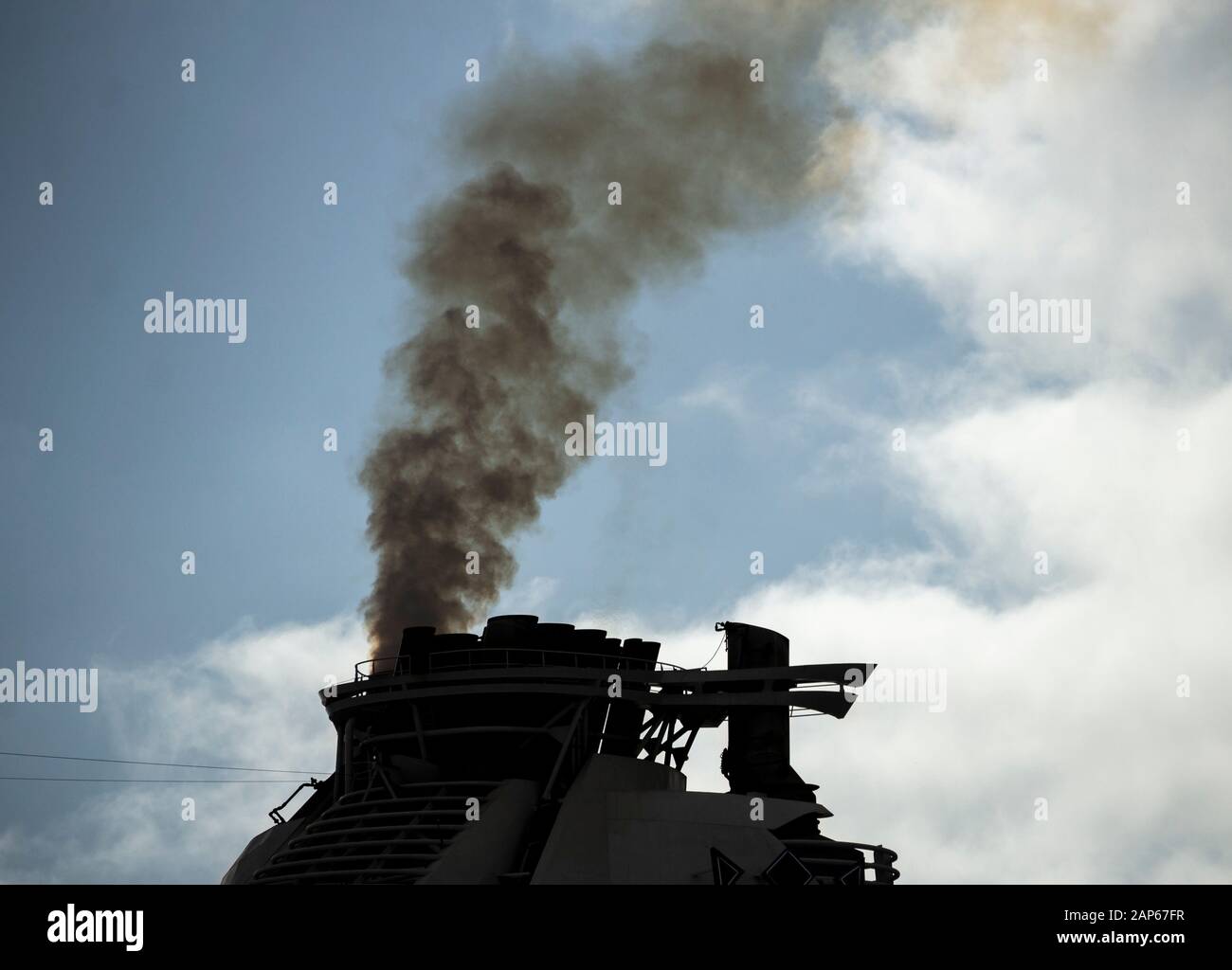 Black smoke from cruise ship funnel. Stock Photo