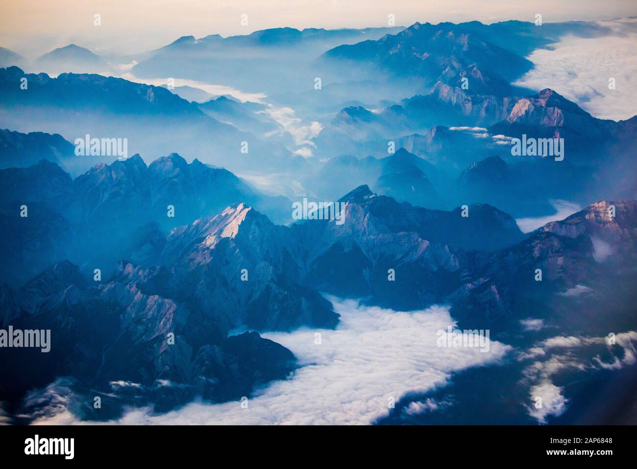 Misty Alpen valleys, aerial view of central Austria in the morning Stock Photo