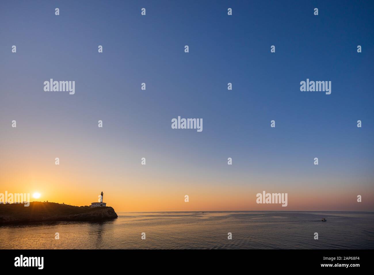 Mallorca, Portocolom lighthouse with sunrise, lots of copy space Stock Photo