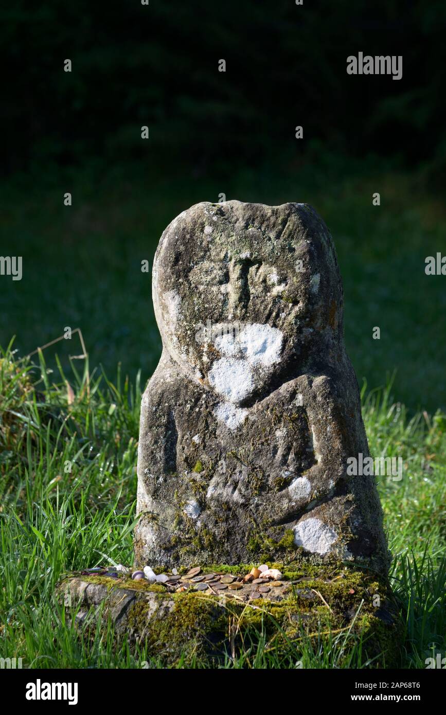 The Lusty Man in early Christian Caltragh graveyard. Boa Island, Fermanagh, N. Ireland. Ancient probably Celtic or prehistoric carved stone figure Stock Photo