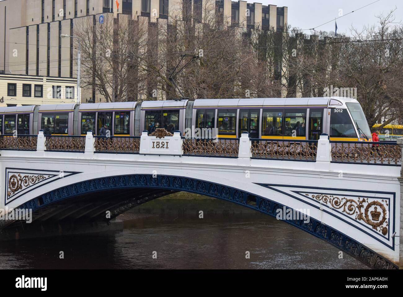 Dublin, Ireland - January 20, 2020: A Luas tram crossing the river liffey from the north side of Dublin to the south in dublin, ireland. Stock Photo
