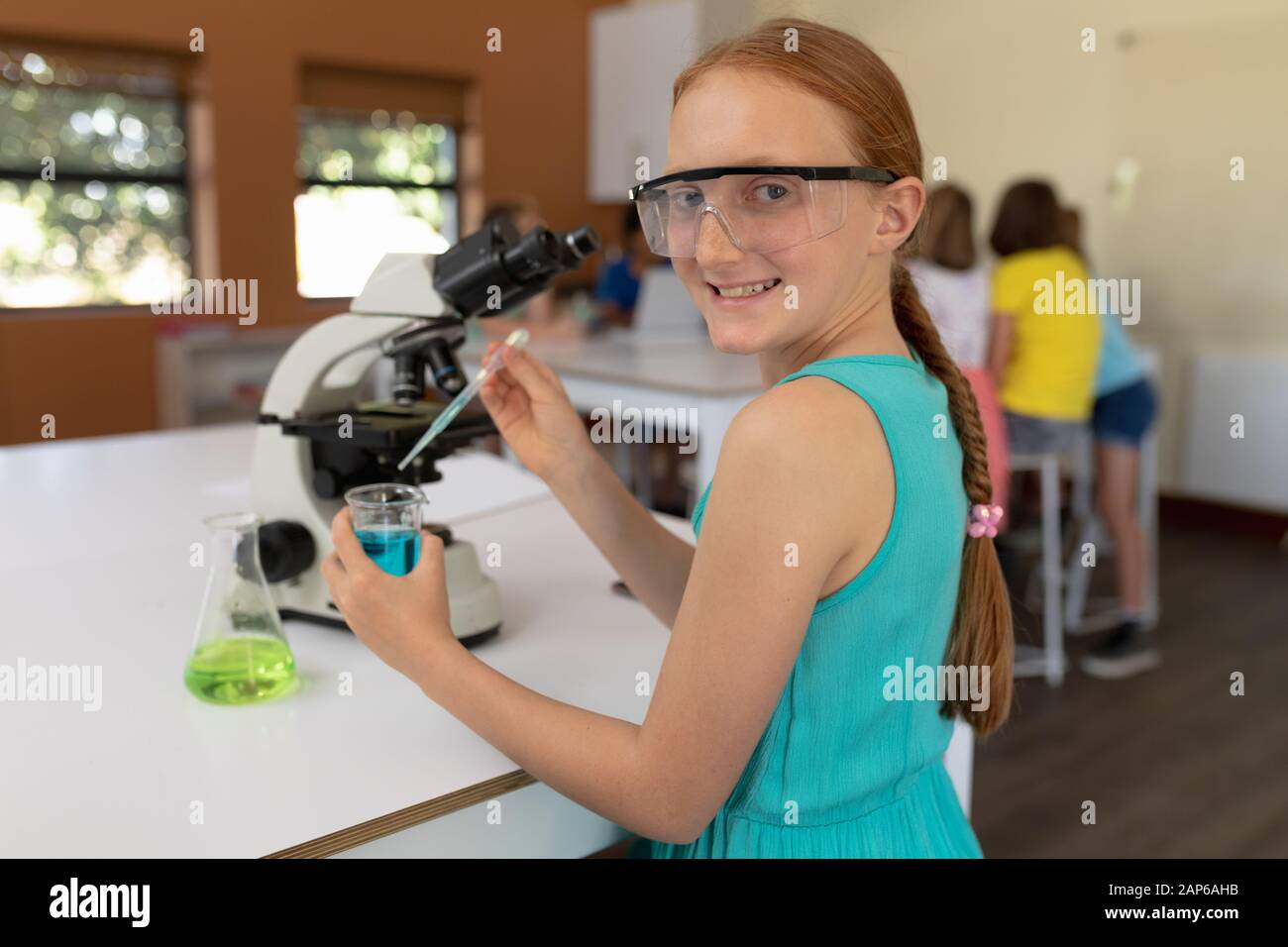 Elementary school girl in chemistry class Stock Photo Alamy