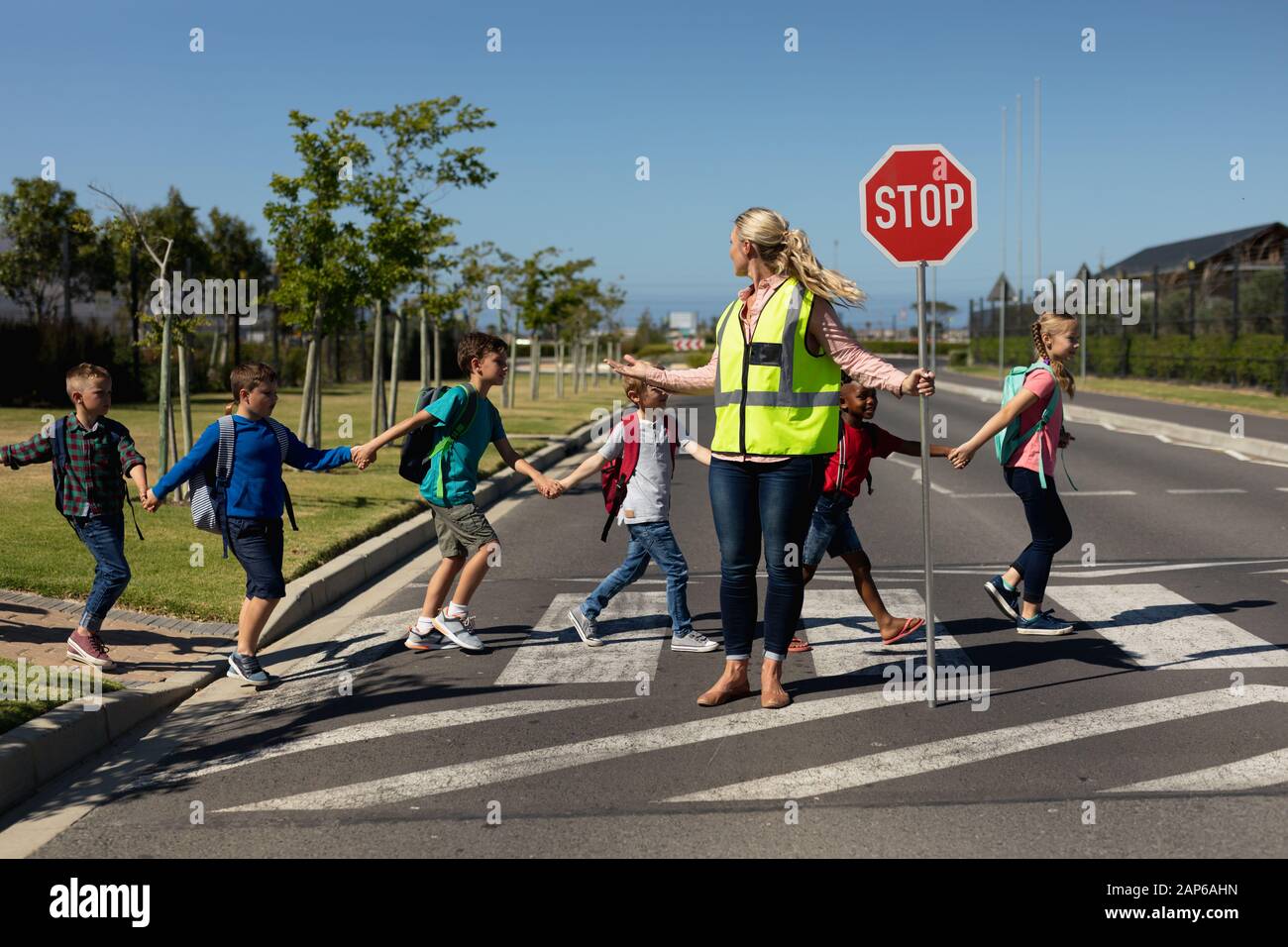 Holding Stop Sign High Resolution Stock Photography and Images - Alamy