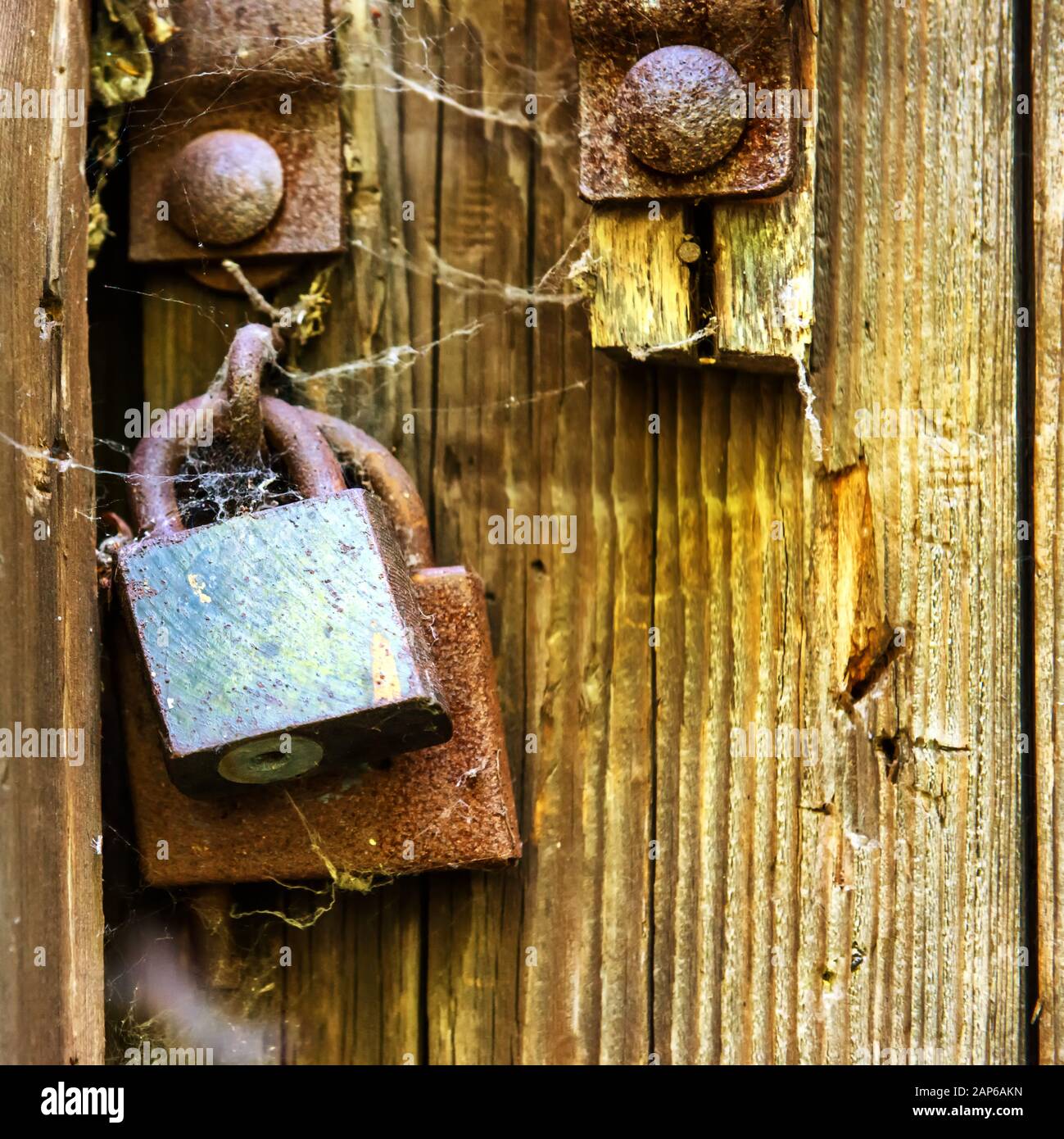 Retro wooden door with old rusty lock in old house Stock Photo - Alamy