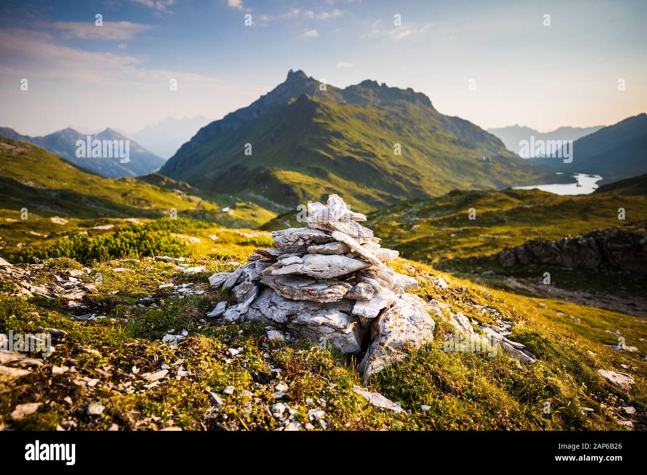 Stone cairn with Giglachsee lake behind, Austria Alps Stock Photo