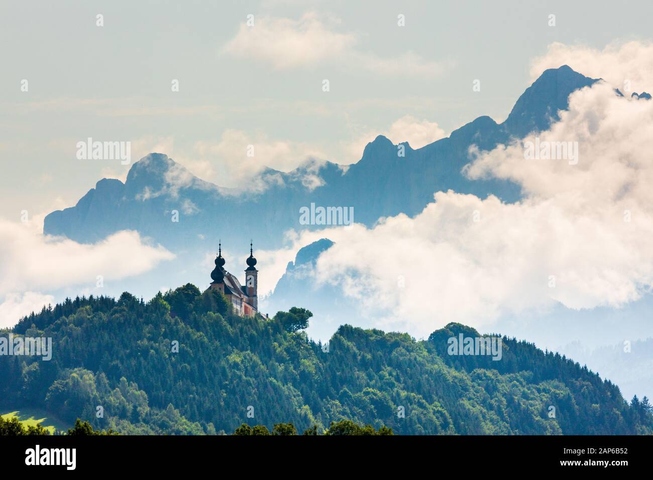 Wallfahrtskirche Frauenberg an der Enns with clouds behind, Ardning, Austria Stock Photo