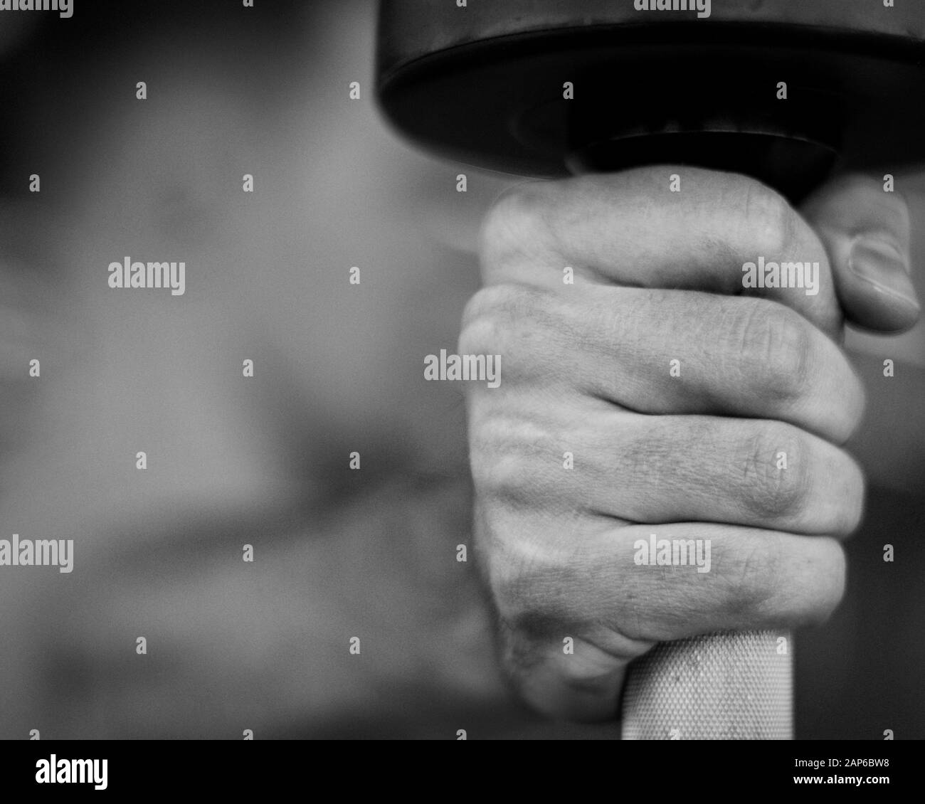 Closeup action shot of weightlifter's hand holding dumbbell Stock Photo Alamy