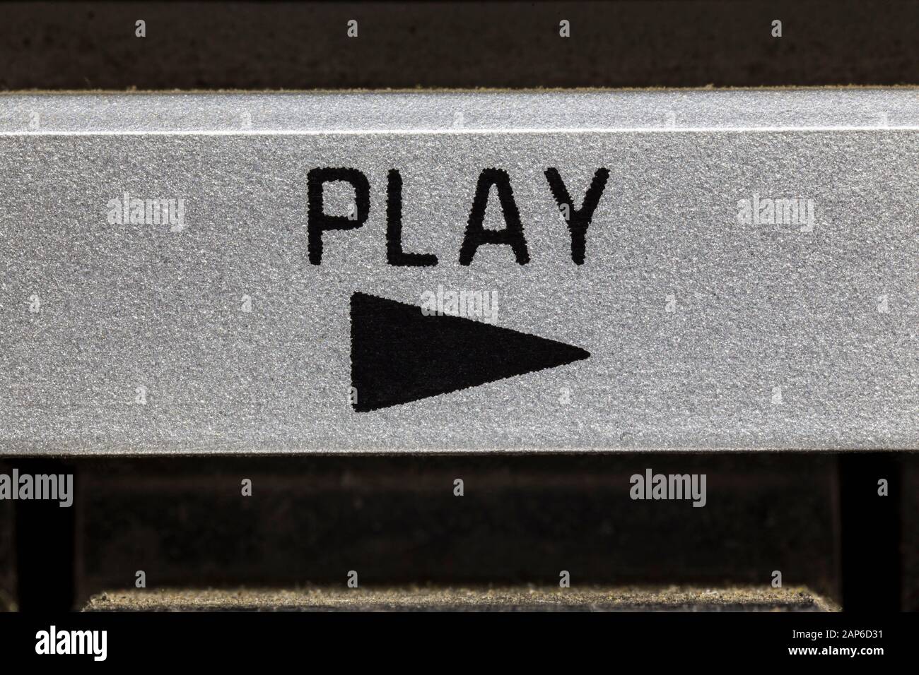 Macro close up photograph of play button on vintage boombox stereo. Stock Photo