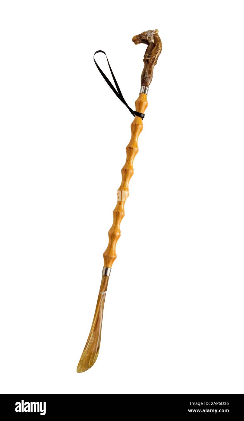 Shoe horn isolated on white background. Plastic shoehorn our spoon for