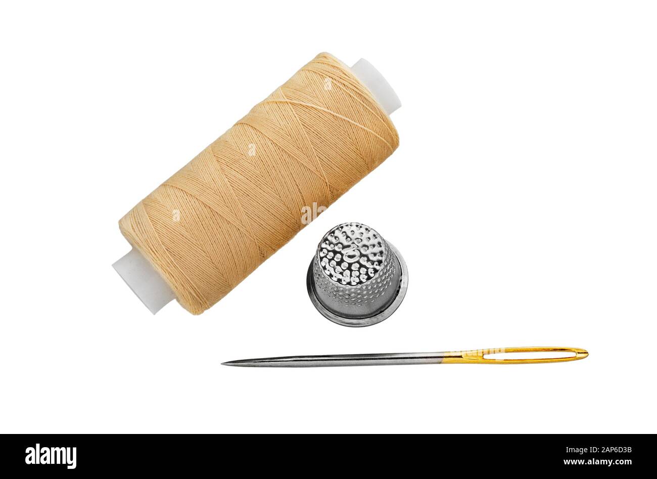 Sewing Threads spool with sewing Needle and Thimble isolated on white background Stock Photo