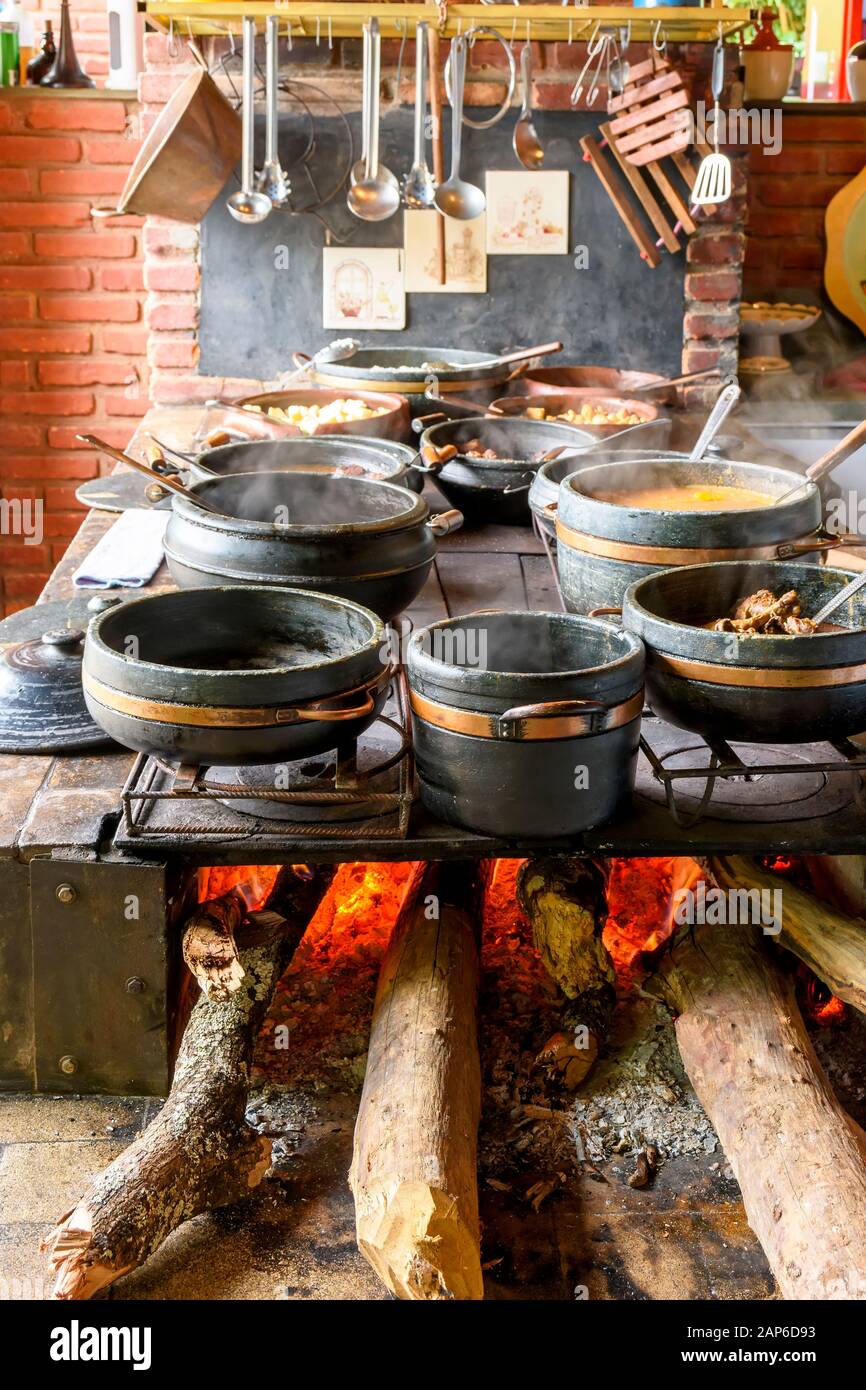 Traditional wood burning stove preparing typical Brazilian food in the kitchen of a farm Stock Photo