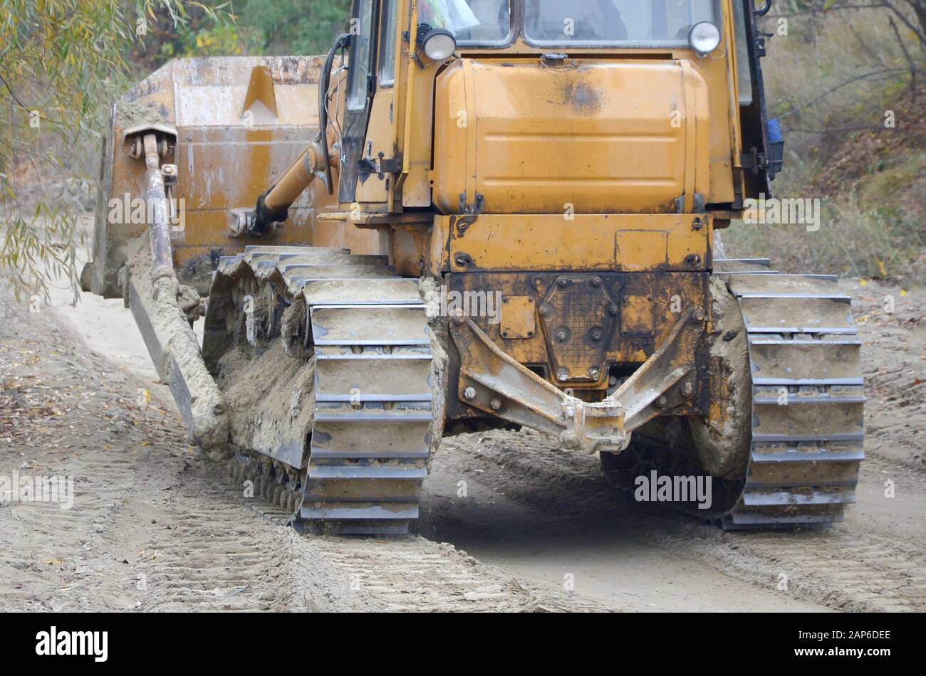 Quarry aggregate with heavy duty machinery on Construction industry. Caterpillar loader Excavator with backhoe driving to construction site quarry Stock Photo