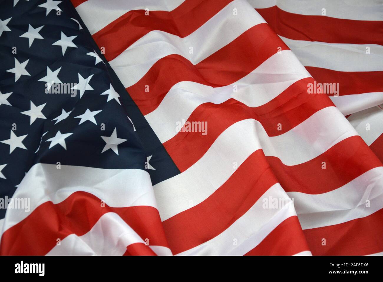 Closeup of American flag on plain background. Colorful waving horizontal US  banner with stars and stripes Stock Photo - Alamy