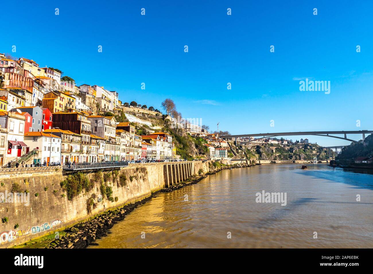 Porto Douro River Picturesque View of a Rua do Ouro Street with Arrabida Bridge on a Sunny Blue Sky Day in Winter Stock Photo