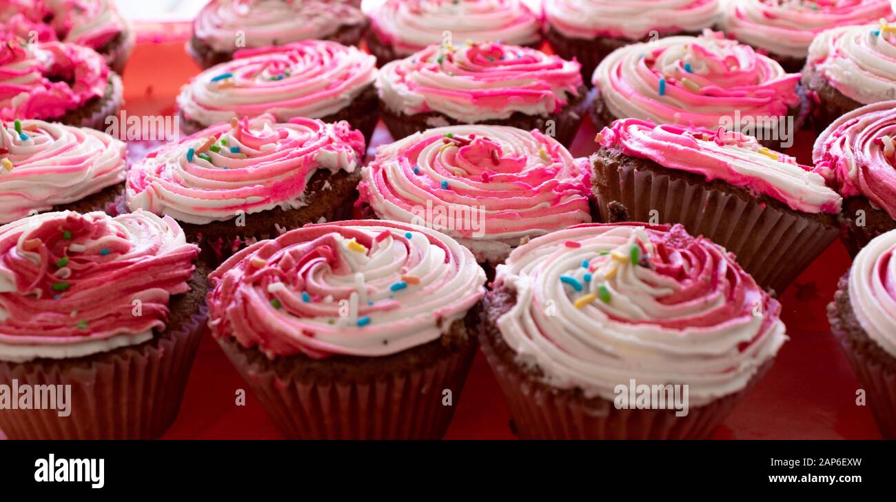 cupcake with strawberry icing on top Stock Photo