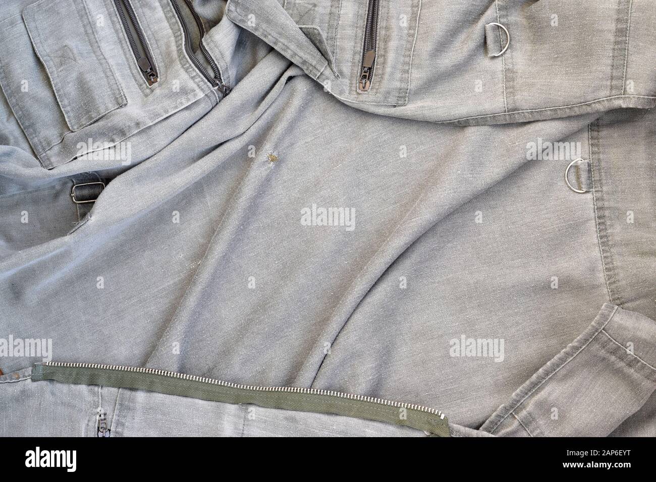 The texture of the fabric is olive-colored, which is similar to the fisherman or hunters waistcoat. Background image for fishing and hunting design. Stock Photo