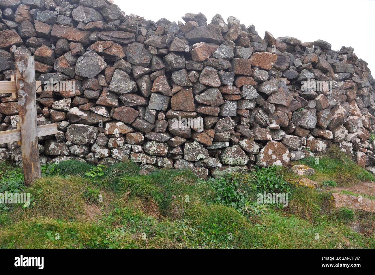 Dry stone wall by the coastal path on the Lizard peninsula in Cornwall,random granite stones,multi coloured serpentine. Stock Photo