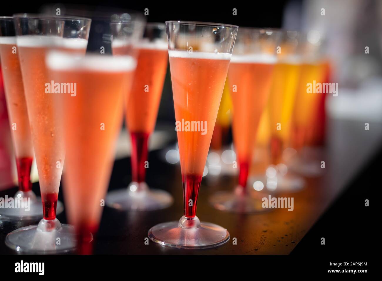 Row of colorful cocktails on bar Stock Photo