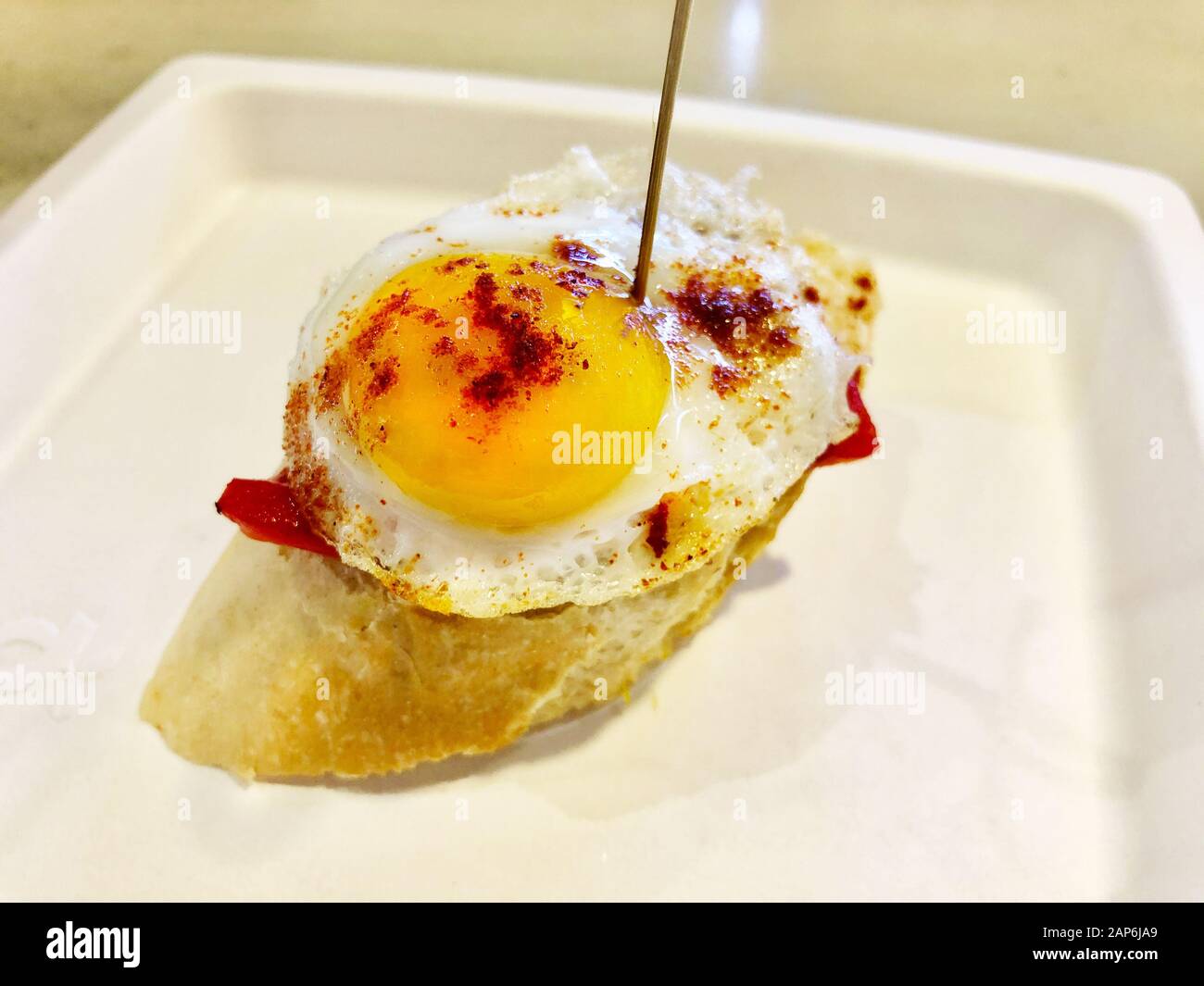 Spanish Pincho with fried egg and red bell pepper Stock Photo