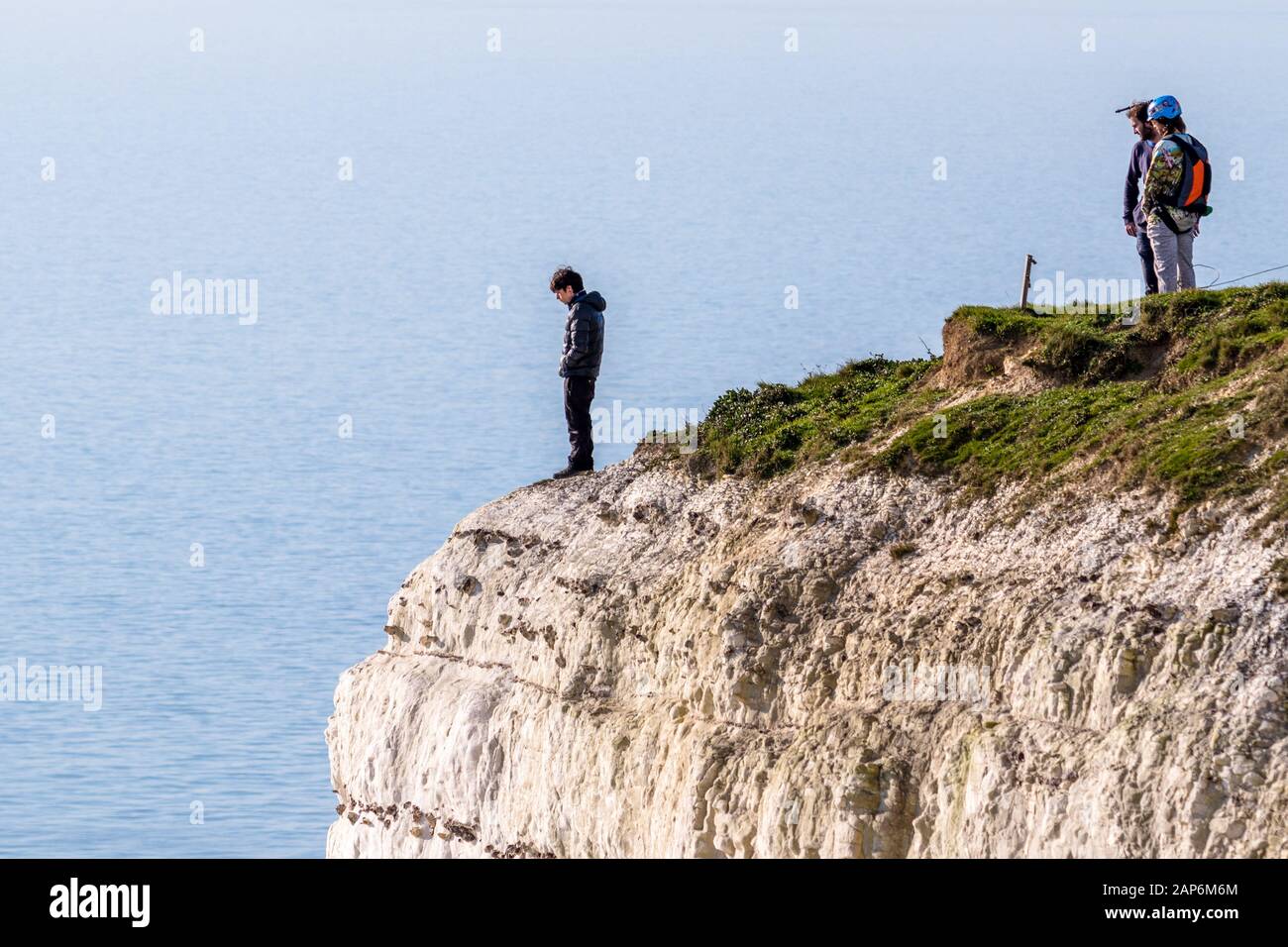 Base jumpers prepare to leap off the 400ft cliffs at Beachy Head. Stock Photo