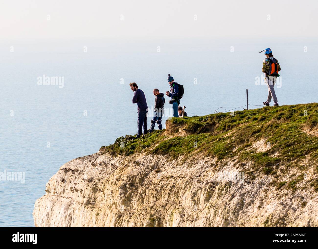 Base jumpers prepare to leap off the 400ft cliffs at Beachy Head Stock Photo