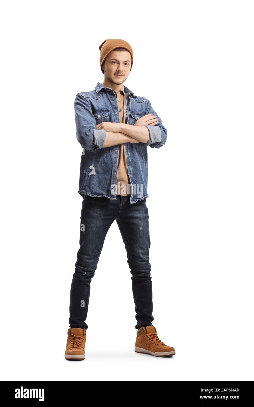 Full length portrait of a guy in jeans and a woolen hat isolated on white background Stock Photo