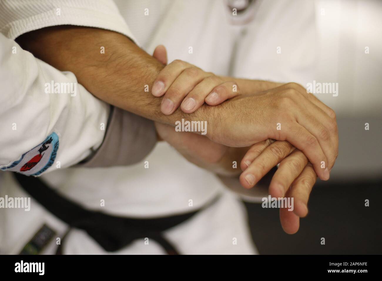Hands of two men performing an Aikido grabing technique Stock Photo Alamy