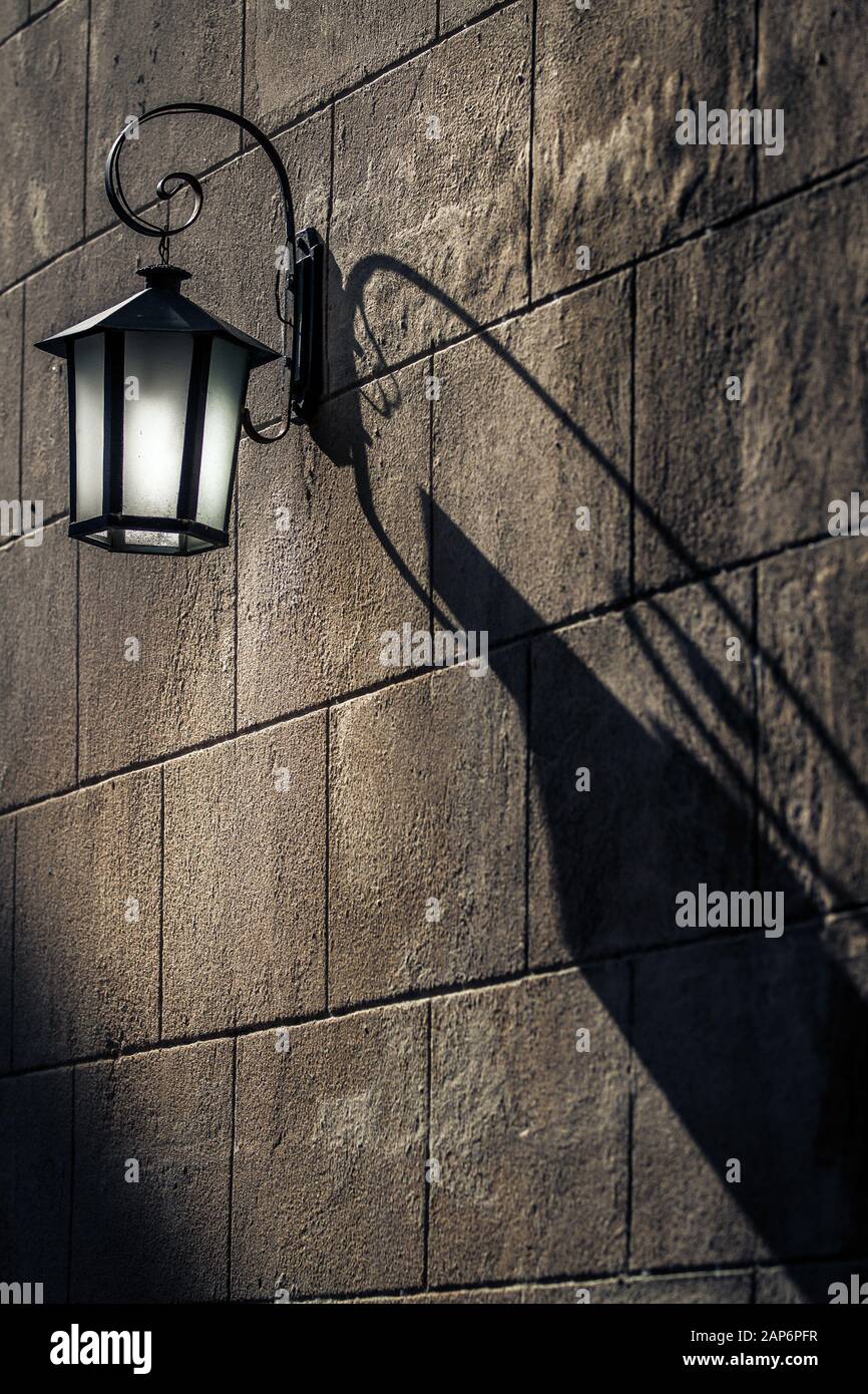 Vintage Lantern with Shadows on the wall Stock Photo - Alamy