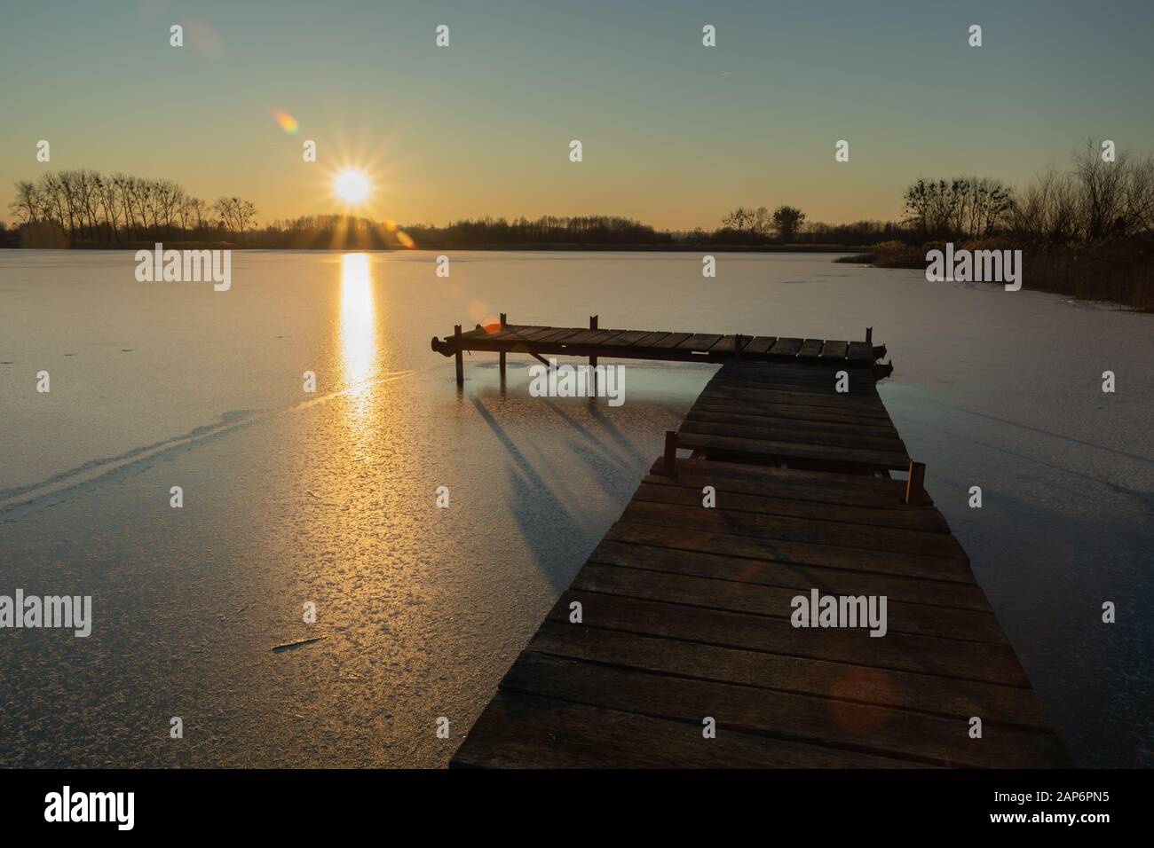 Frozen lake sunset landscape hi-res stock photography and images - Alamy
