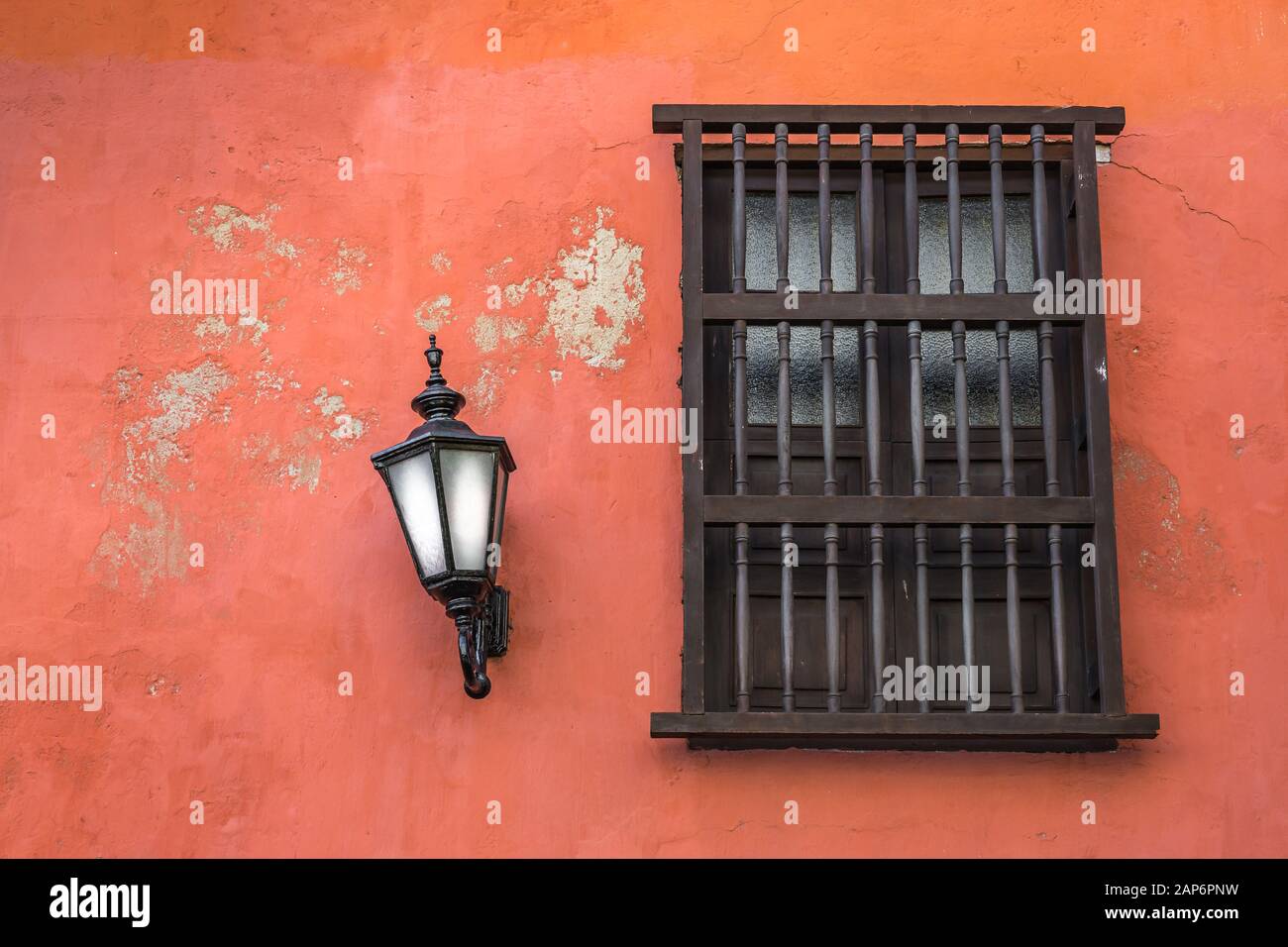 Spanish style window on orange wall with lantern Stock Photo Alamy