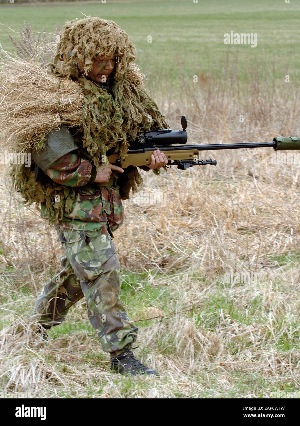 British Infantryman with a long range sniper rifle L115A3 which has a killing capability from over a mile. Stock Photo