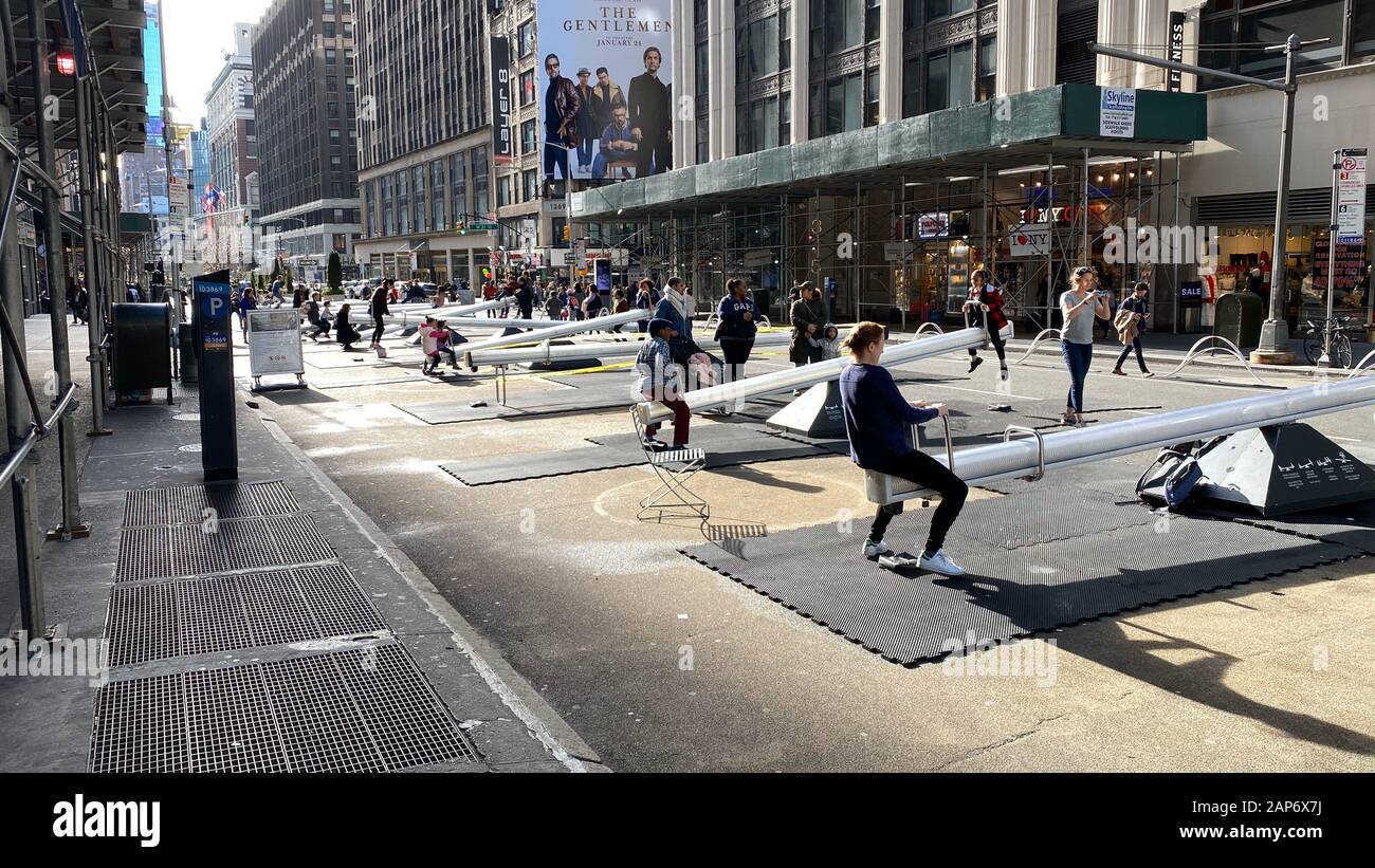 Seesaws on Broadway is an interactive art installation in the Garment District in NYC and is being enjoyed by children of all ages. Stock Photo