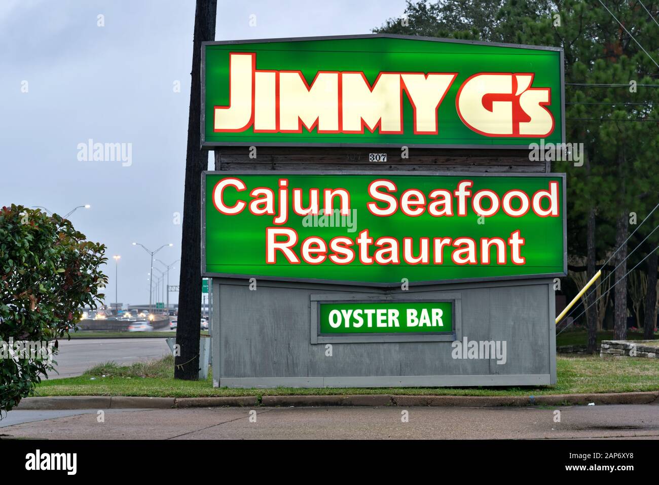 Houston, Texas/USA 01/15/2020: Jimmy G's Cajun Seafood Restaurant neon road sign by Beltway 8 in North Houston, TX. Established in 2012. Stock Photo