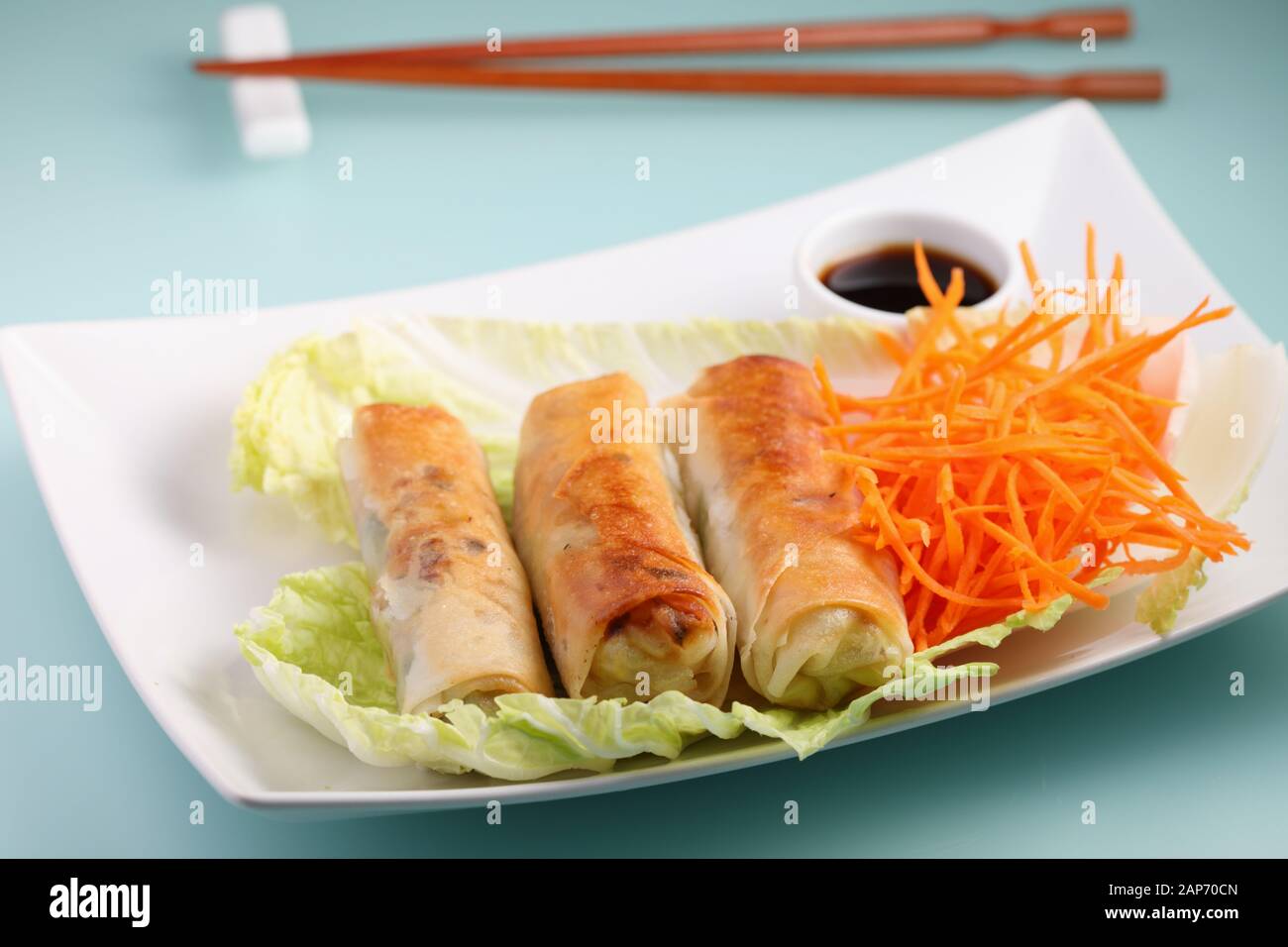 Spring rolls with napa cabbage and carrots served with soy sauce Stock Photo