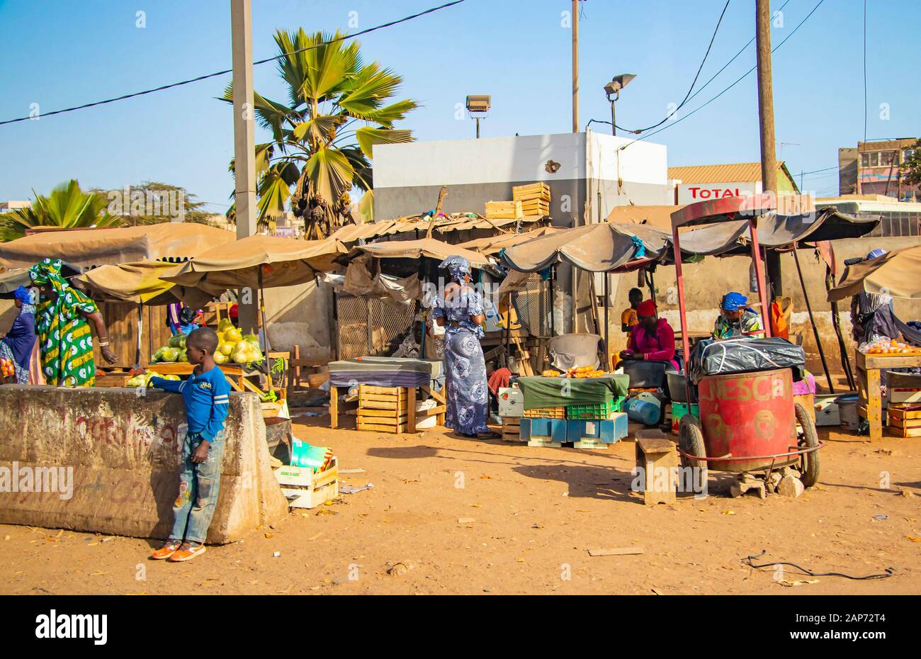 MBour, Senegal, AFRICA - April 22, 2019: Street fruit market where locals sell tropical fruits like melons, mangoes, oranges, lemons and more. Stock Photo
